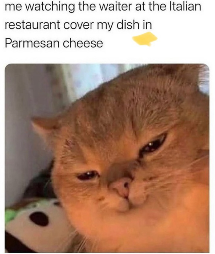 me watching the waiter at the Italian restaurant cover my dish in Parmesan cheese