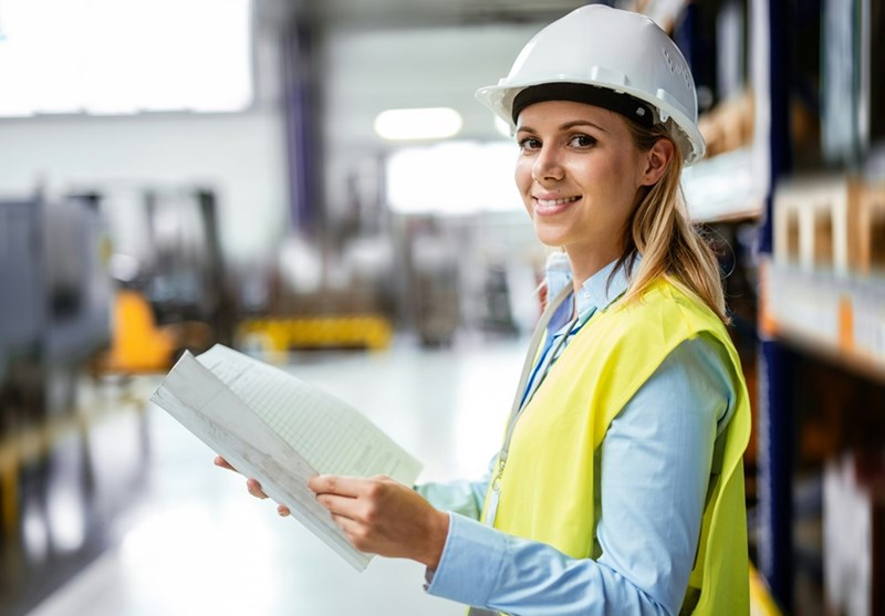 A young female engineer working at a new company that respects her PTO and work-life balance. 