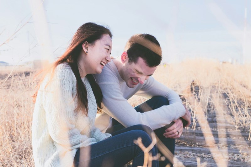 man and woman laughing