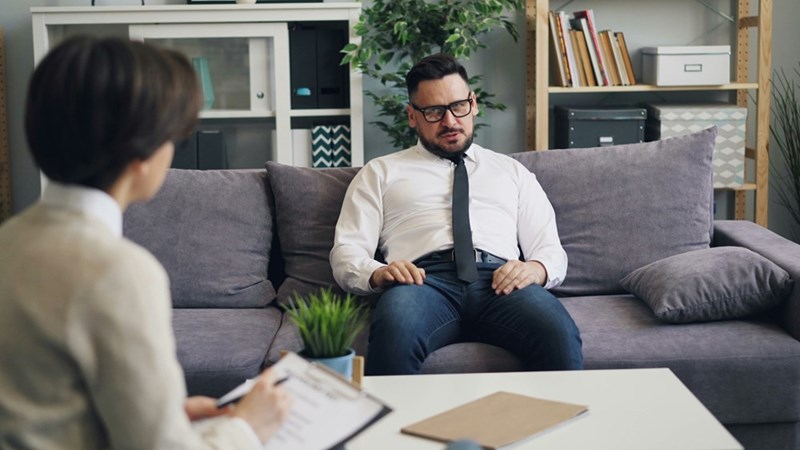 a man talking to a psychologyst