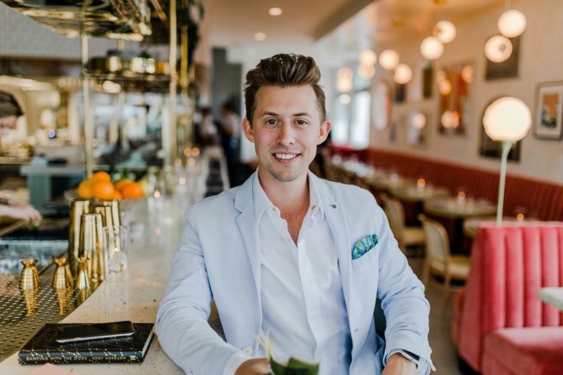 Visual representation of a male worker of a hotel front desk.