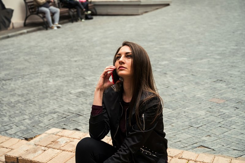 woman making a call with her cellphone