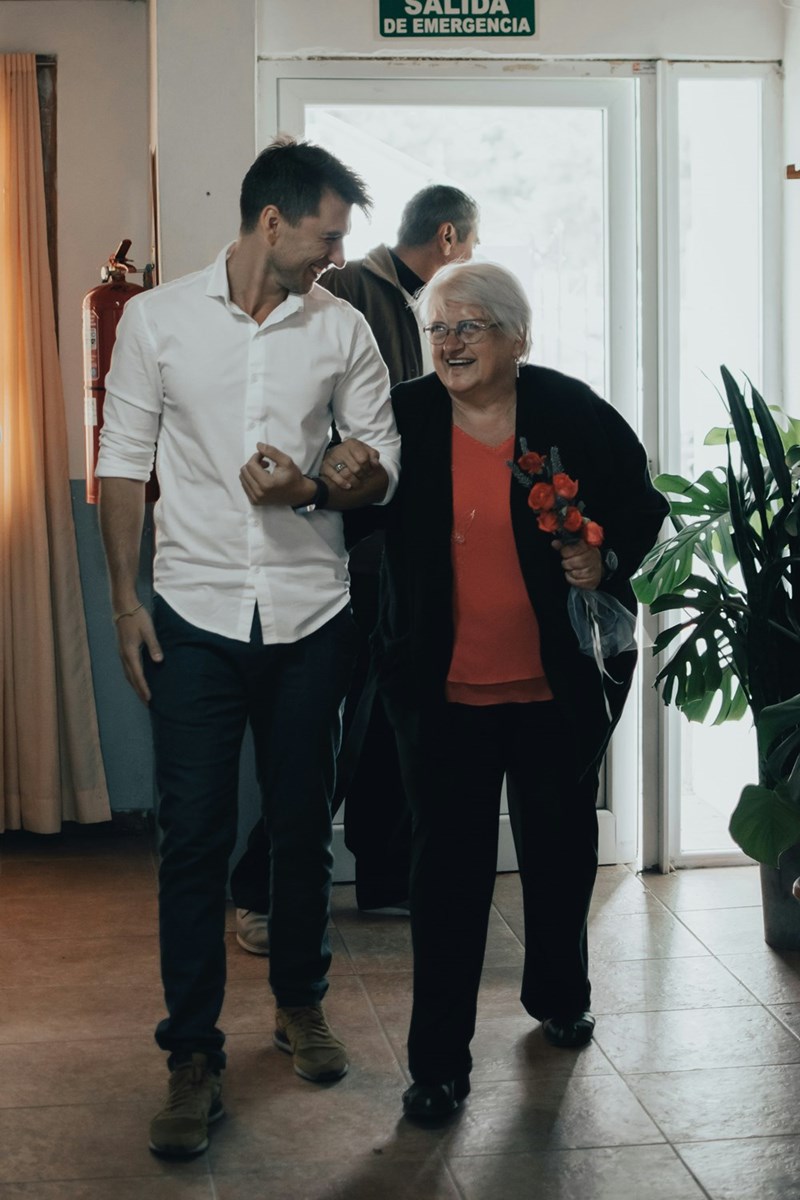 man standing beside old woman and laughing