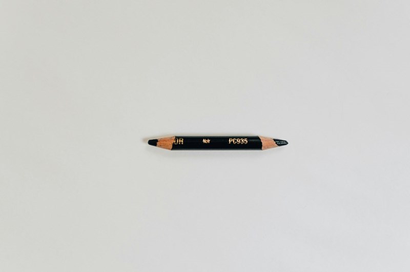 A stubby “golf pencil," which is easy to use when writing down scores on the golf course, but difficult to write with for longer stretches of time. 