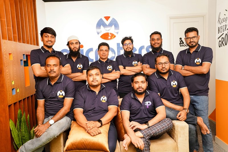 A group of different coworkers posing in their uniforms, model image.