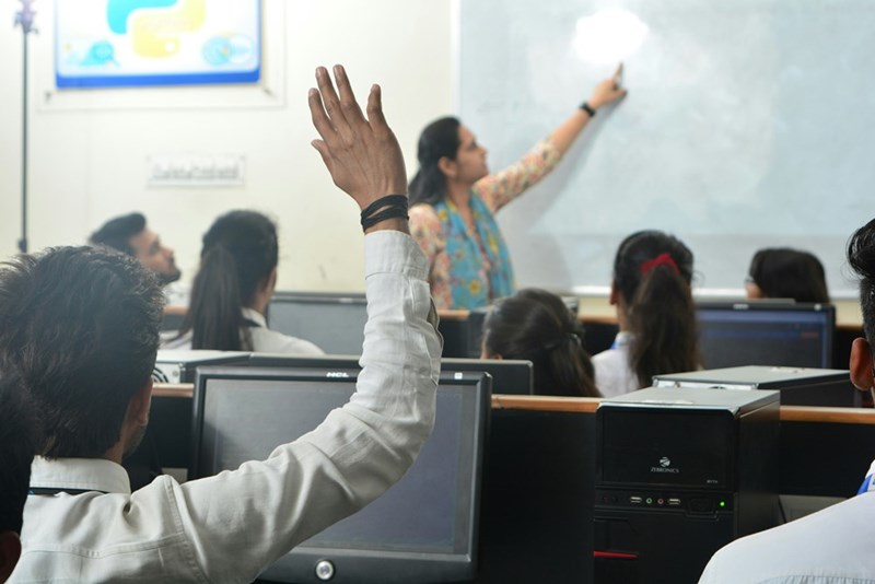 student raises his hand