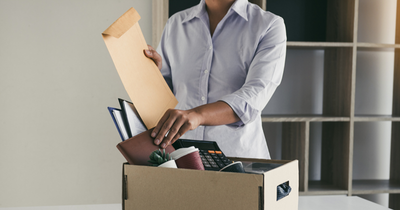 Employee packing up their belongings after quitting.