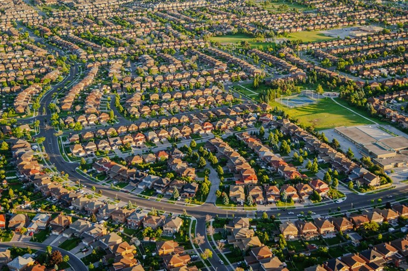 A suburban area far from the city center makes commuting more difficult for residents. 