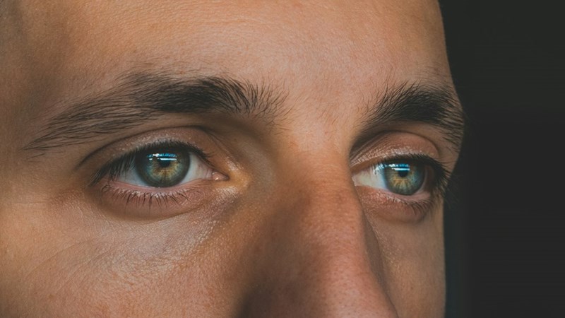A man's eyes, which he would appreciate a compliment about from his partner, instead of a generic compliment. 