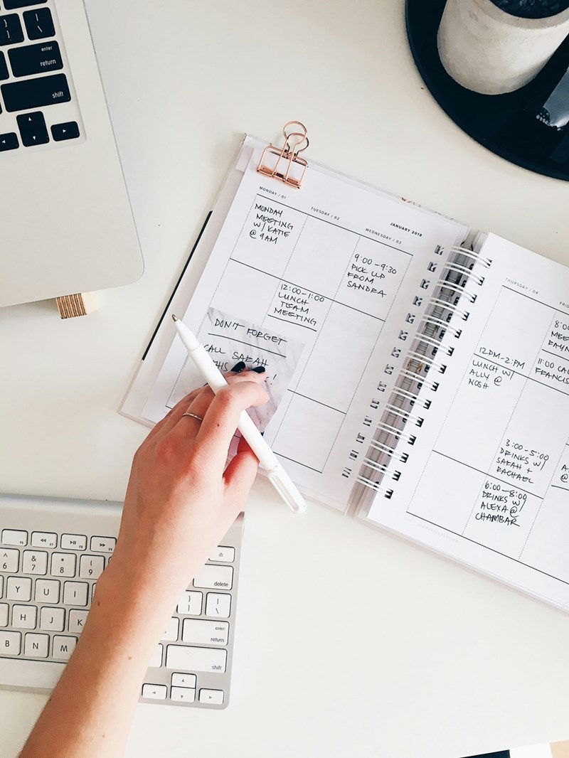 person holding notepad