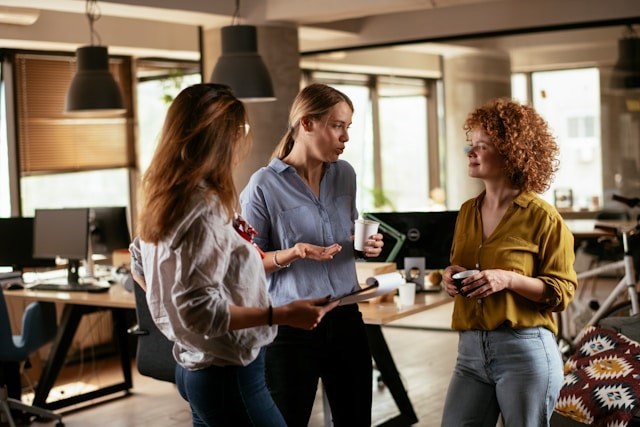 Coworkers spread rumors to each other after their manager tells them too many details about business decisions being made behind the scenes.