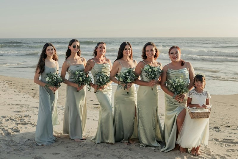 Bridesmaids are wearing mint green, a color that the rest of the wedding guests are not allowed to wear. 