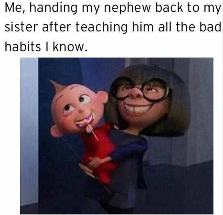 Me, handing my nephew back to my sister after teaching him all the bad habits I know.