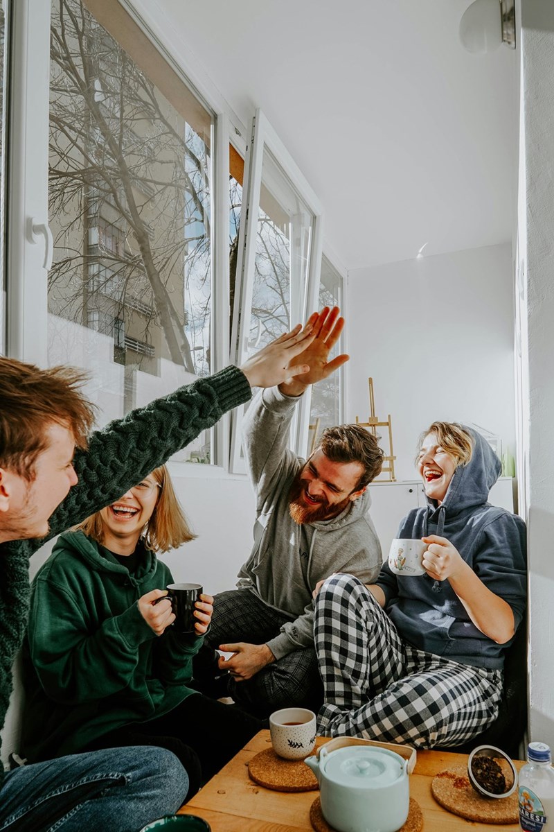 four friends laughing