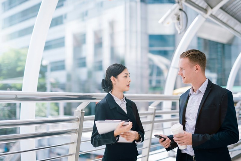 Two workers talking.