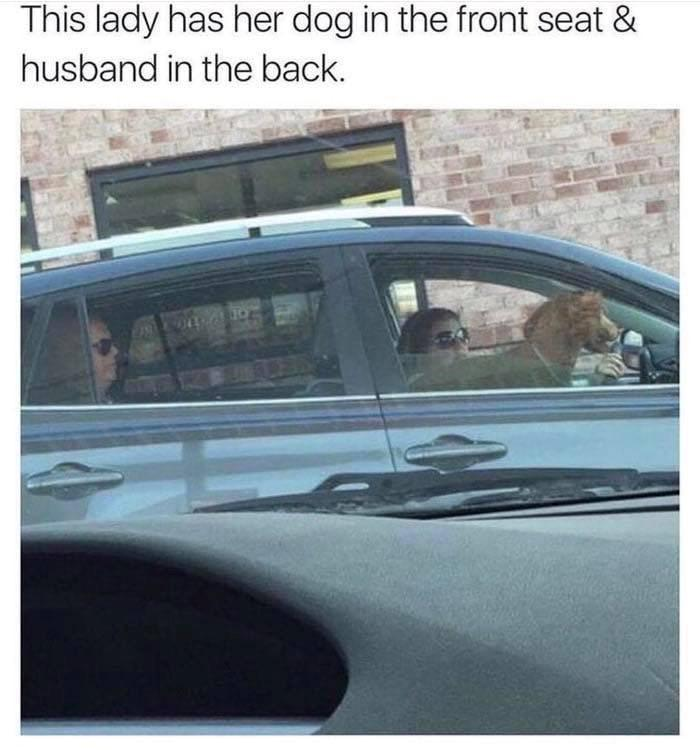 This lady has her dog in the front seat & husband in the back.
