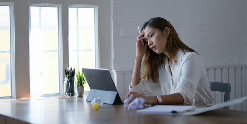Young professional experiences workplace stress while balancing increasing expectations and limited support.
