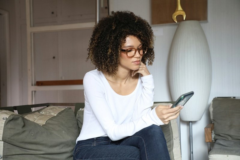 woman looking at cellphone