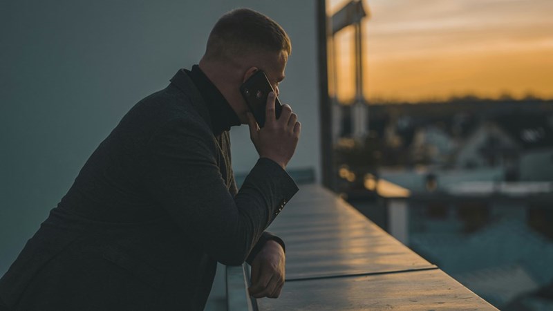 Employee taking a work-related phone call during personal time away from the office.