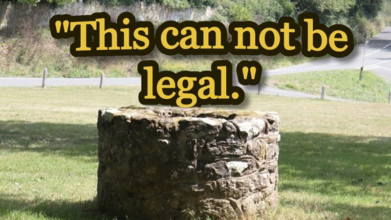 A rural well on private property against a paddock backdrop