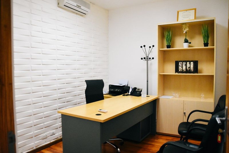 Private office space set up inside a room that was originally intended for shared workplace use and team collaboration.