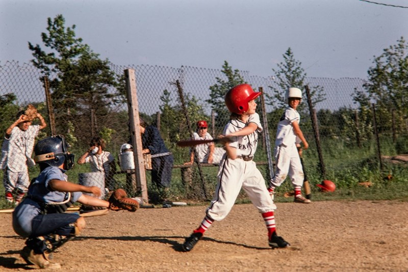 Young baseball team competing during a community game.