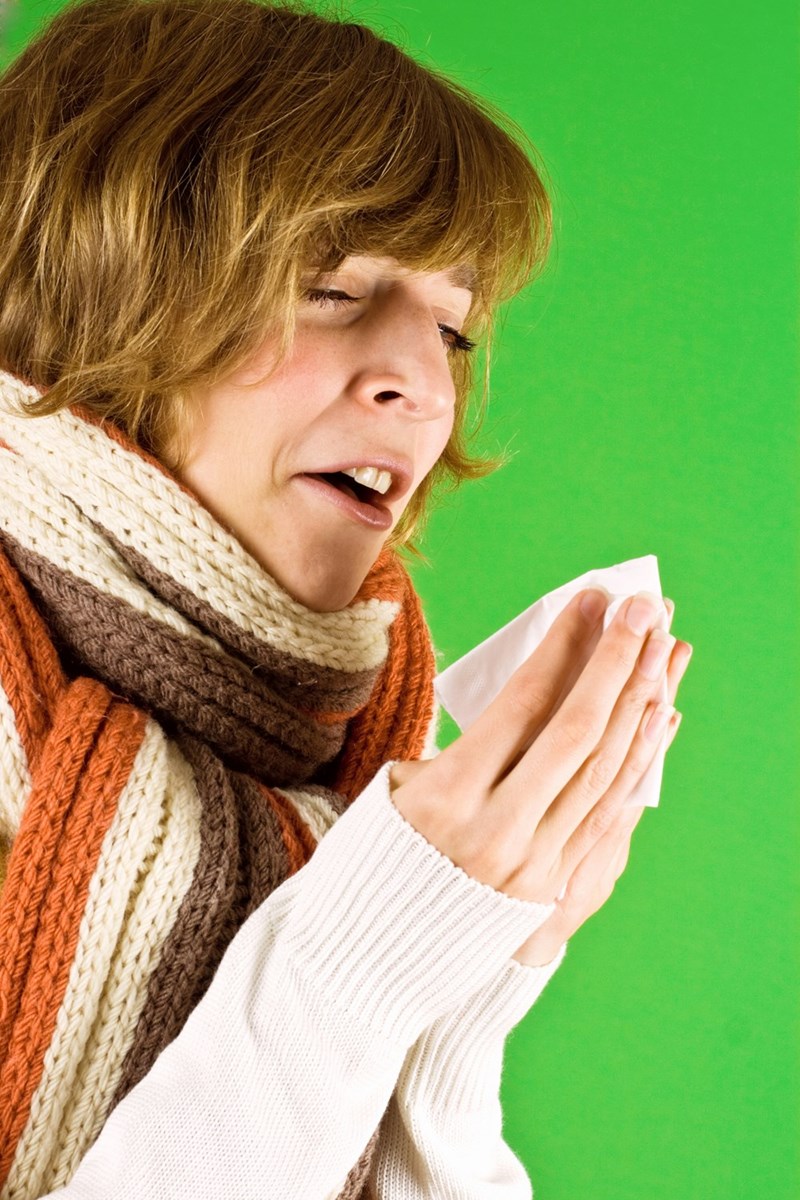 woman sneezing