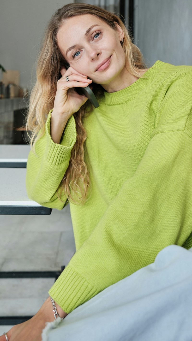 Woman taking a phone call after learning her father promised away her car without permission.