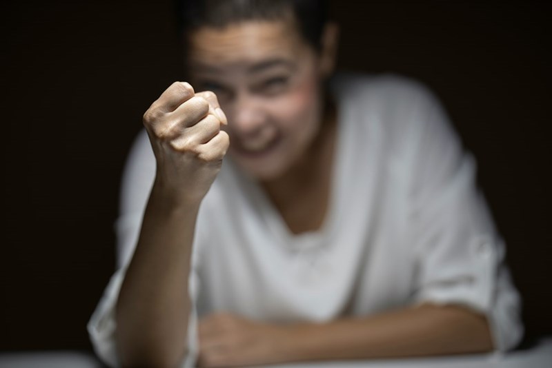 angry woman showing fist