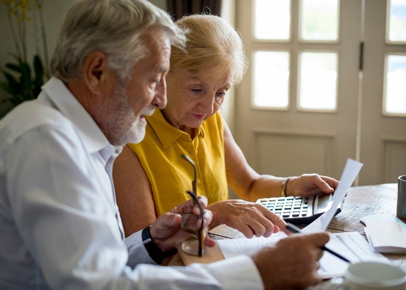 An elderly couple goes through their bills and notices that their water bill this month is higher than usual. 