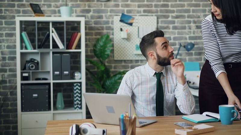 Coworkers navigate an awkward office dynamic after a disagreement over shift coverage and professional boundaries.