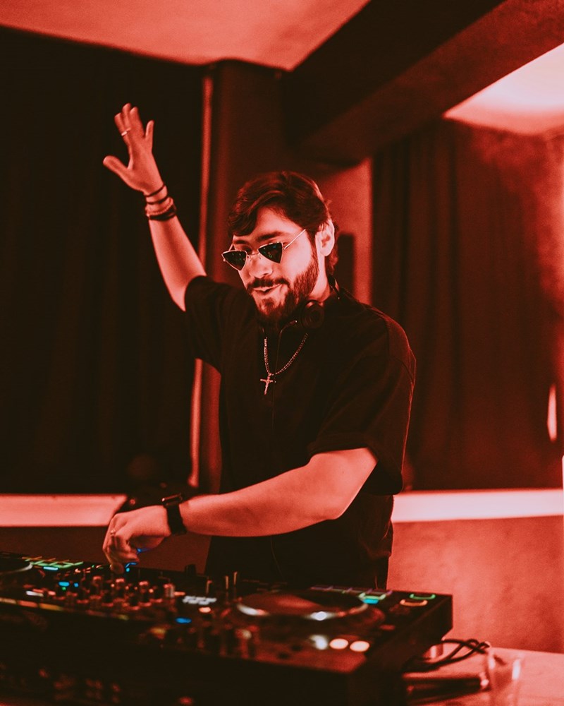 DJ continues practicing his set late into the weeknight, even though his girlfriend's roommate asked him to stop so she could get enough sleep before her early shift.