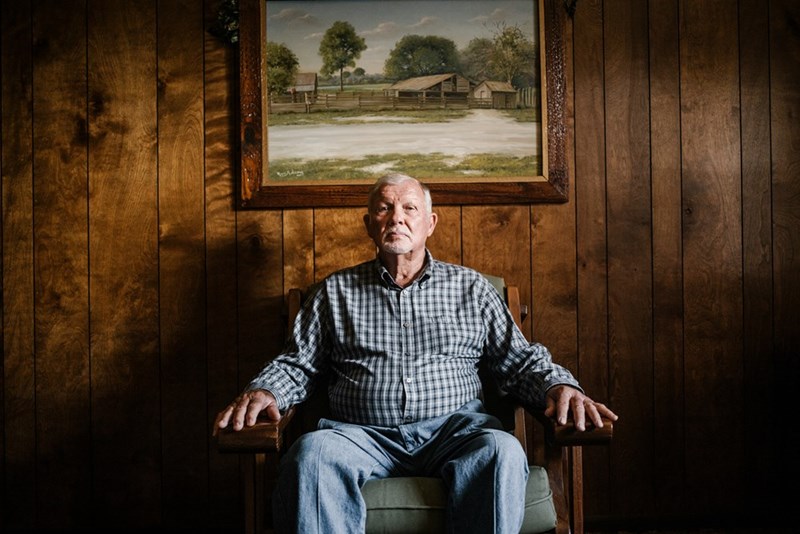 elderly man sitting alone