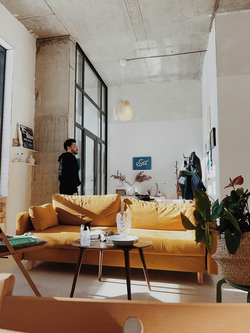 Man standing alone in a living room.