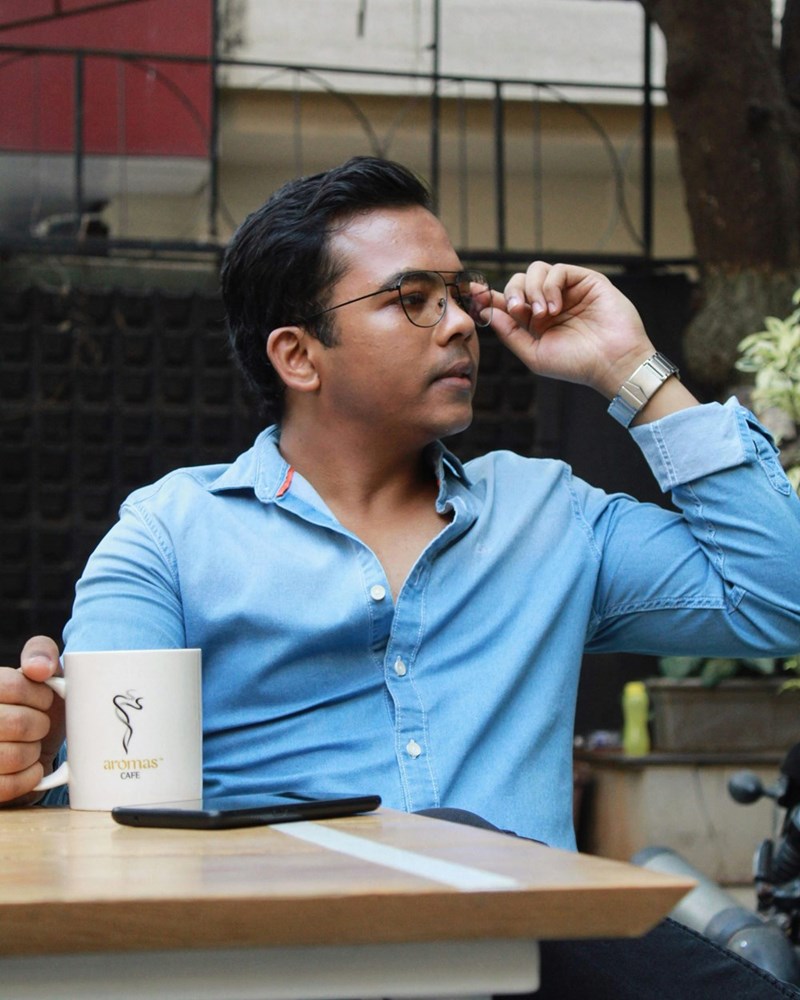 man holding ceramic mug