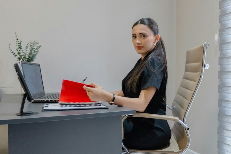 Woman working at desk.