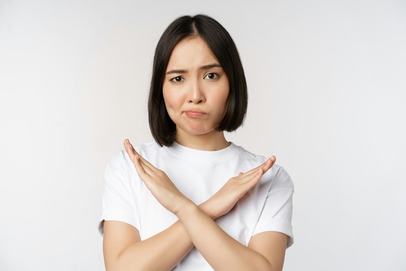 a woman with her hand crossed over her chest