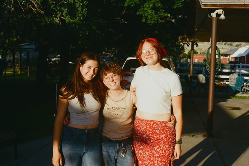 A group of cousins put their arms around each other