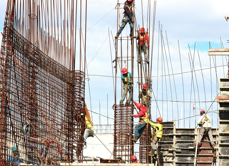 People working in construction during the day.