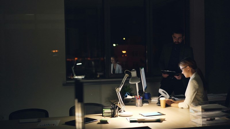 Two coworkers working late together.