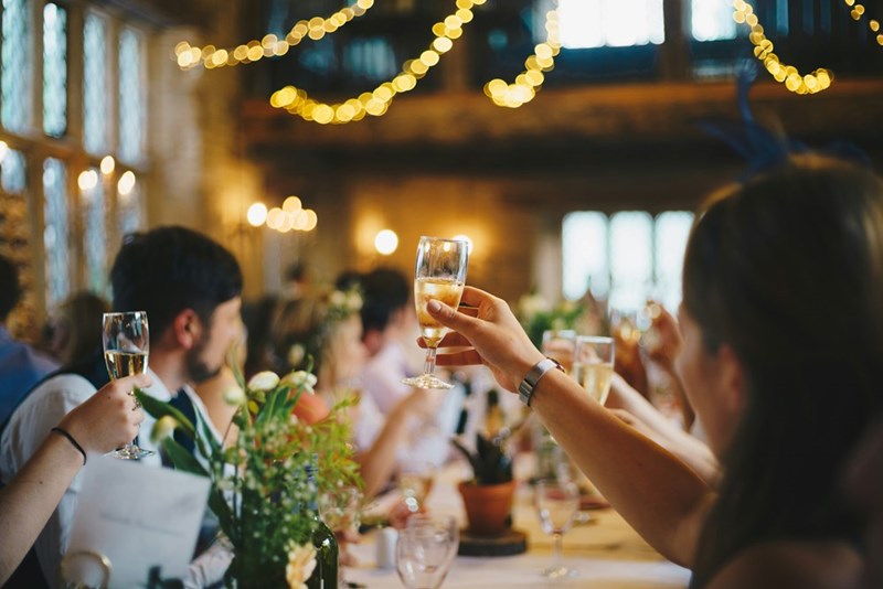 people raisins glasses at wedding