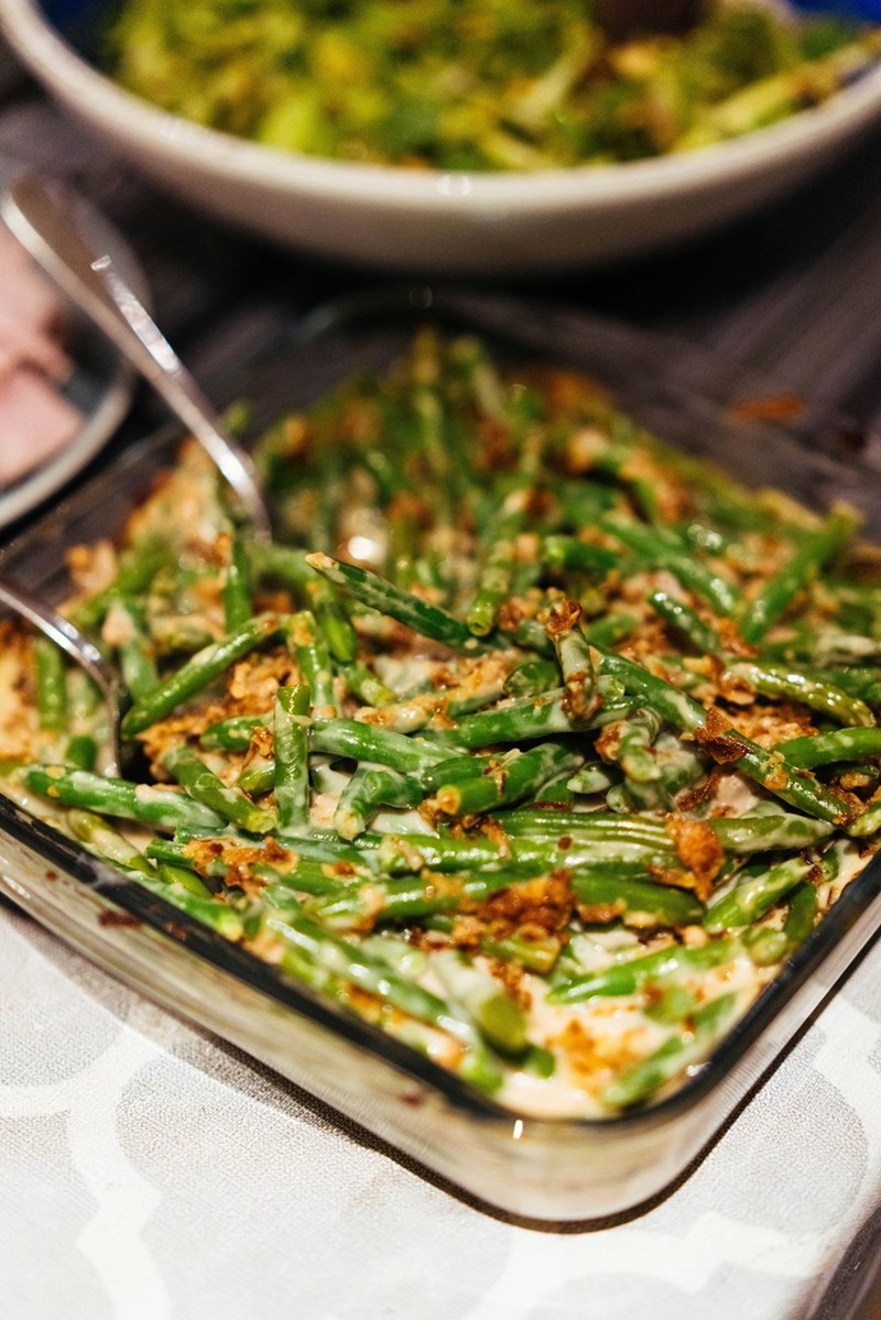 Green bean casserole covered with a crispy topping and served as a traditional holiday side dish.