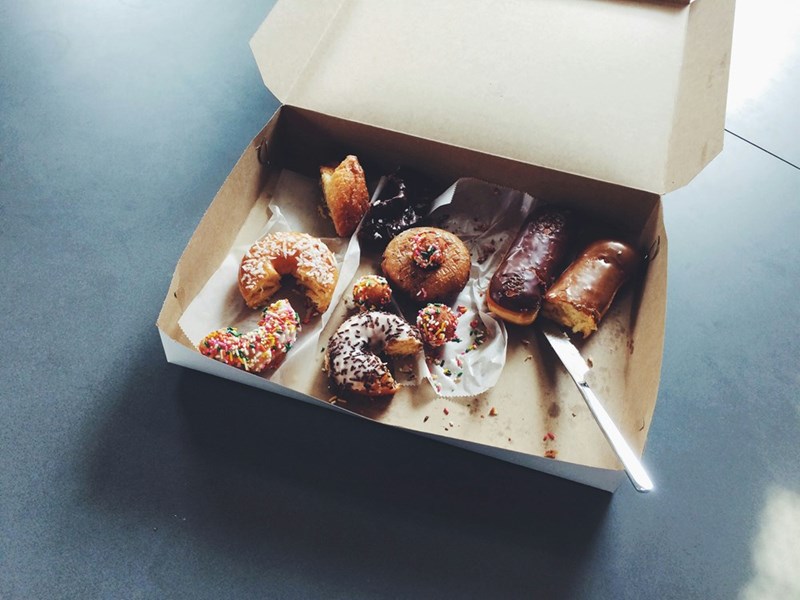 A box of donuts sitting in an office building