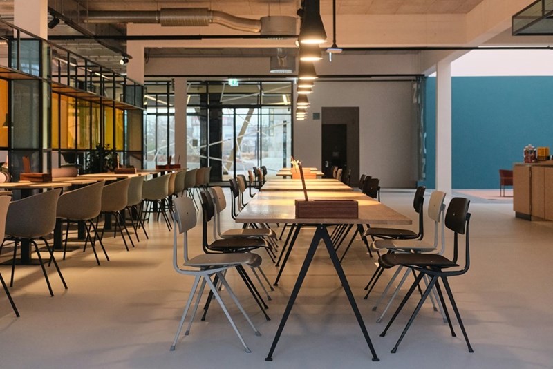 A modern dining area with tables and chairs