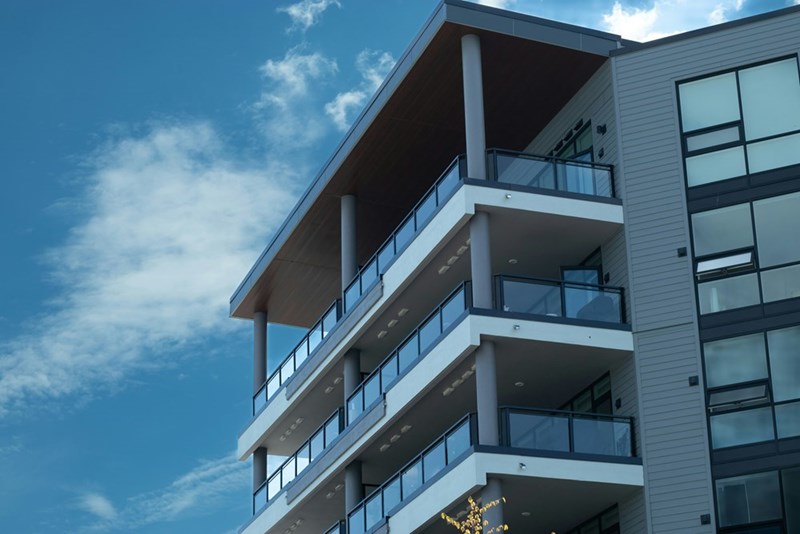 A tall building with balconies.