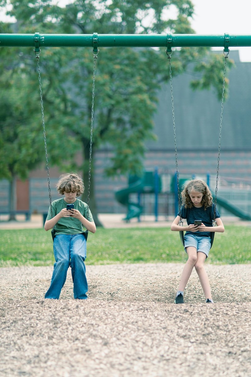 Kids are scrolling on TikTok at the playground instead of actually playing on the swings and interacting with each other. 