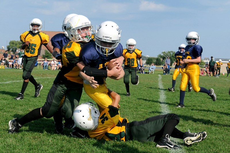 Boys playing football, dreaming of becoming NFL stars