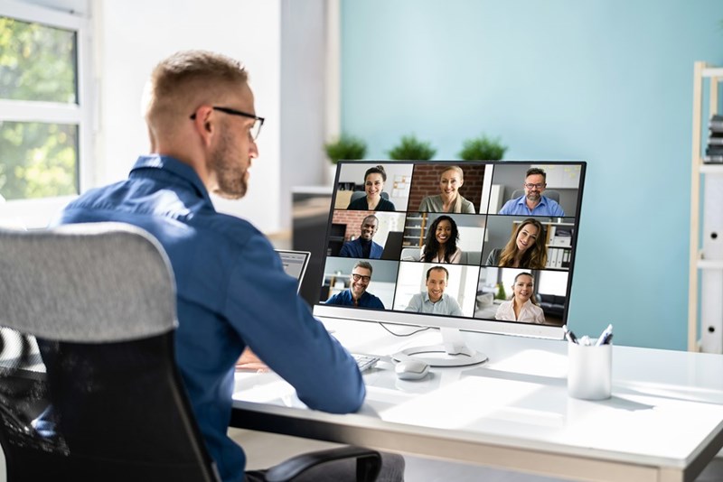 The engineer notices they're missing from an important team meeting as coworkers begin discussing changes without them.