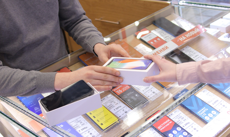 A man purchases a cell phone.