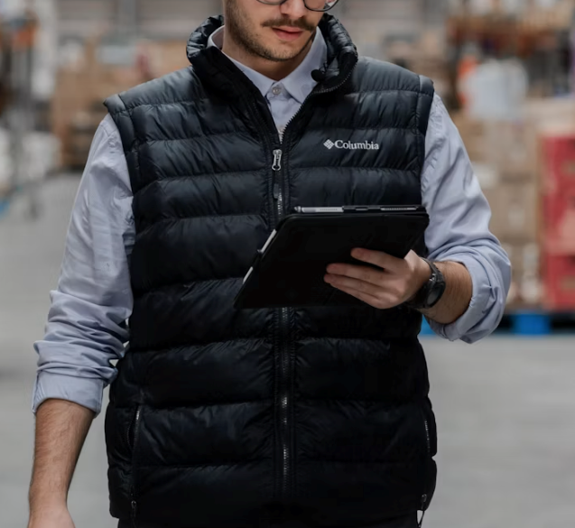 A man reads his notes on a tablet, representing the employee in the story.